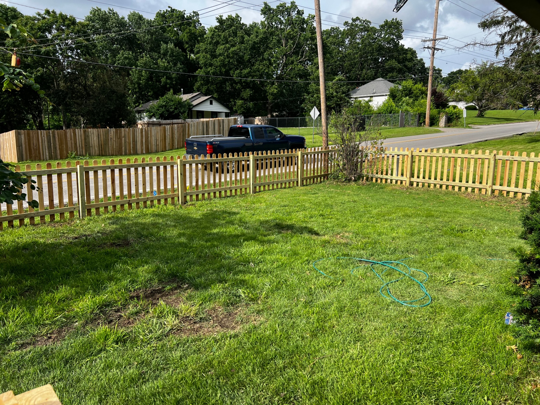 6' privacy Japanese cedar fence running along a front yard property line — Independence, MO